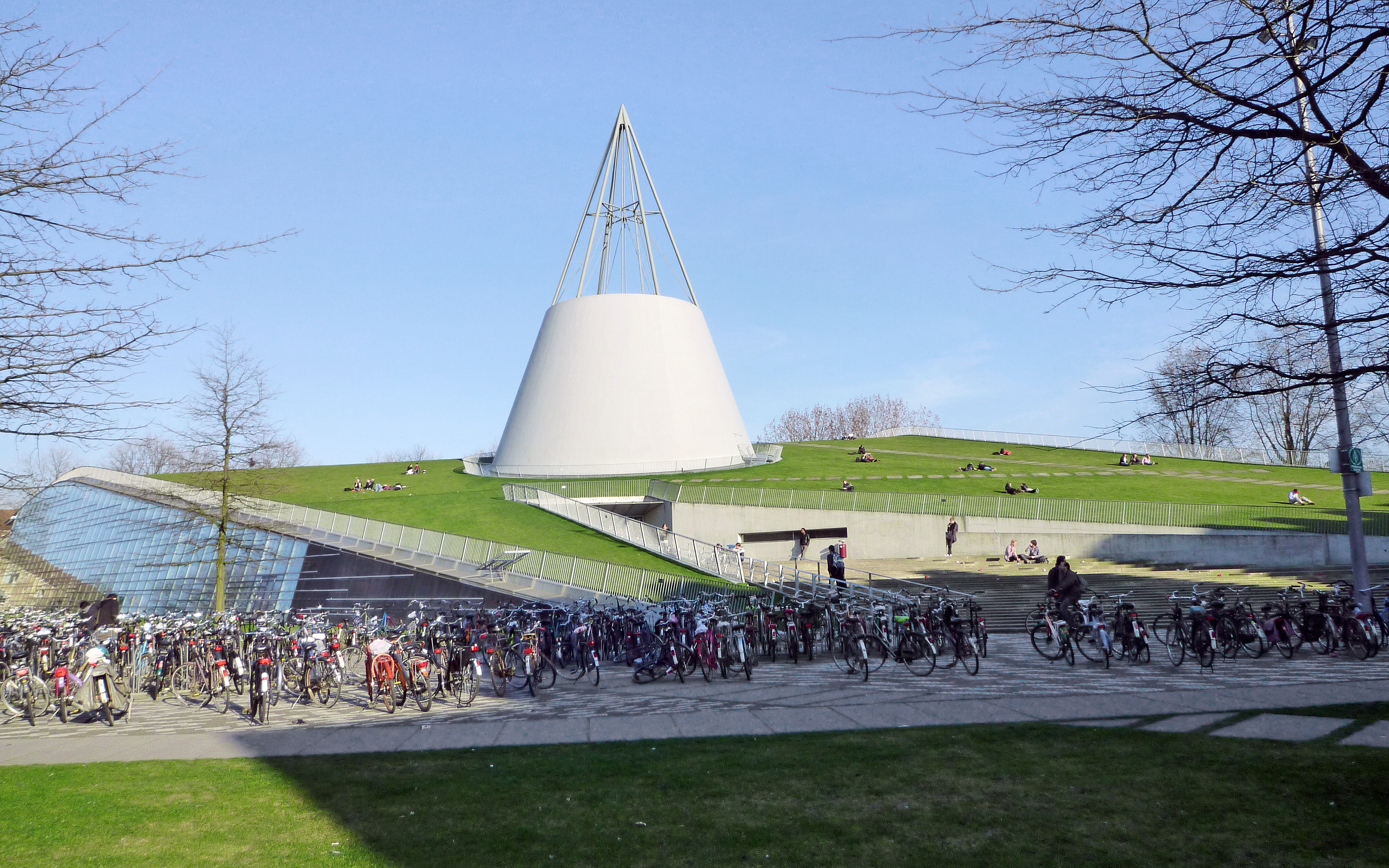 The roof is often used for recreation - even during winter time. People sunbathing on a pitched grass roof